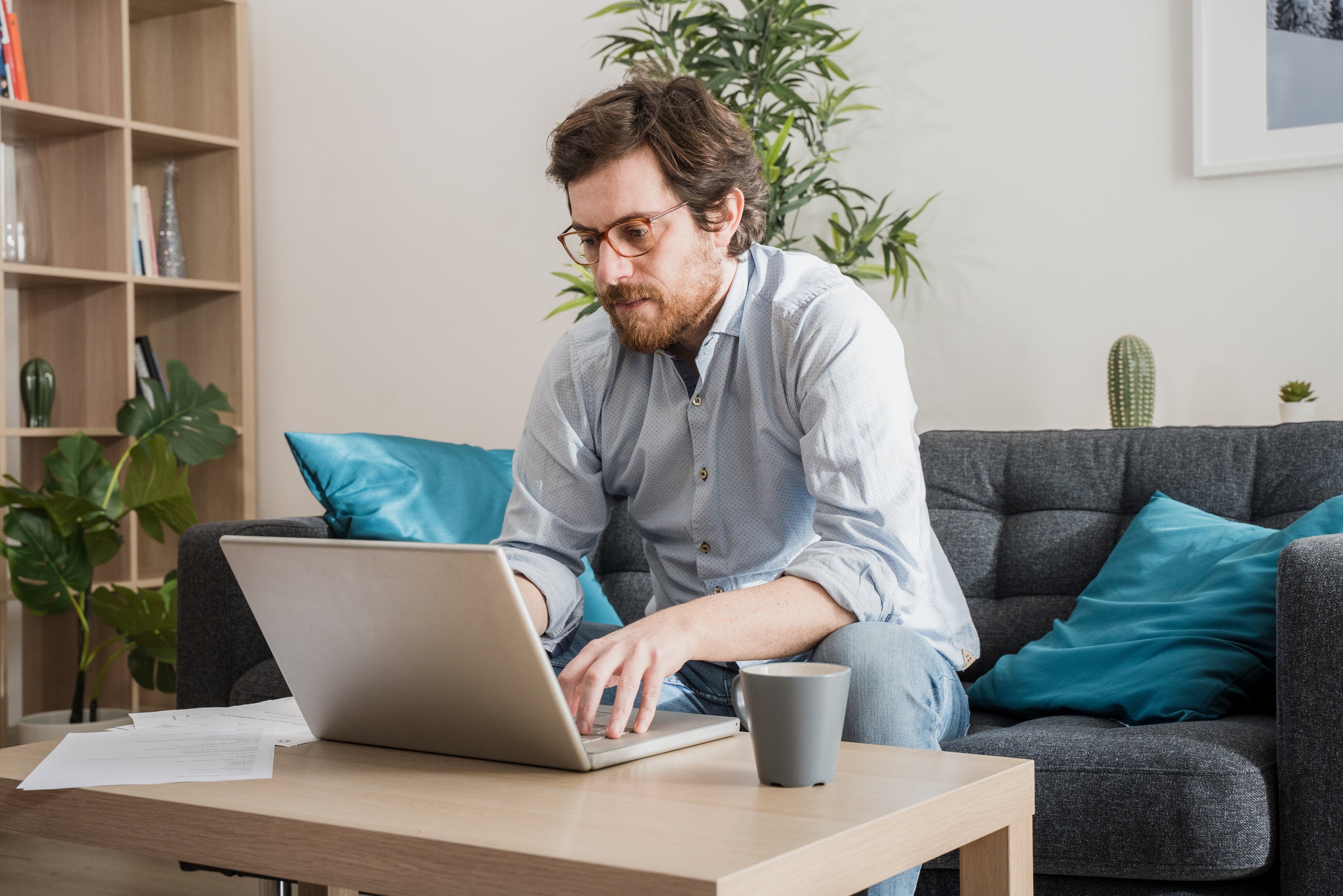 man on laptop working from home