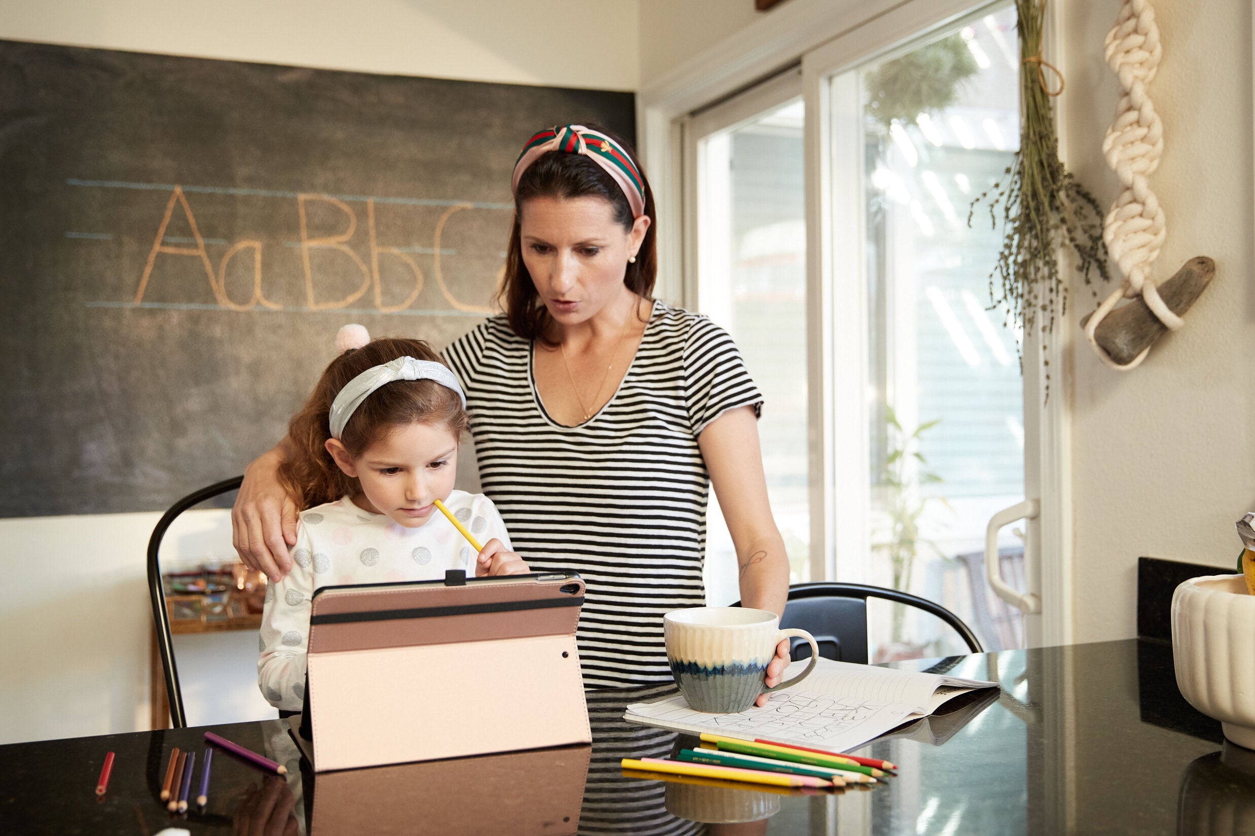 Mom and daughter in homeschool classroom