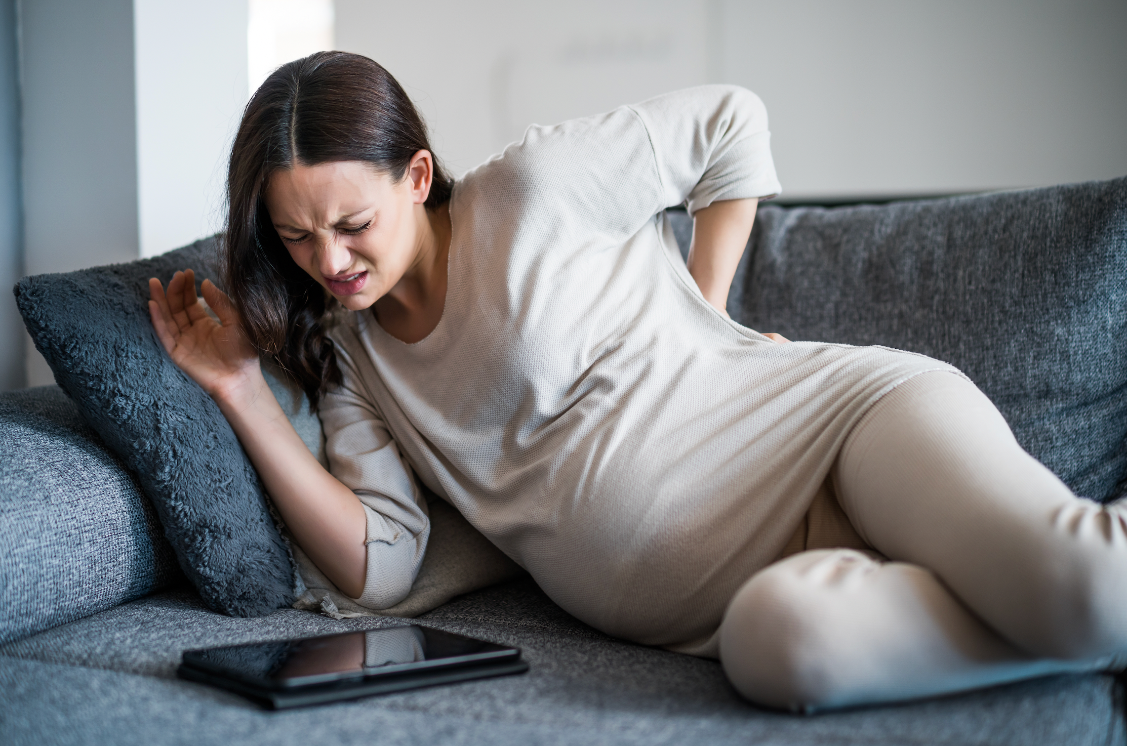 pregnant-woman-stretching-for-back-pain