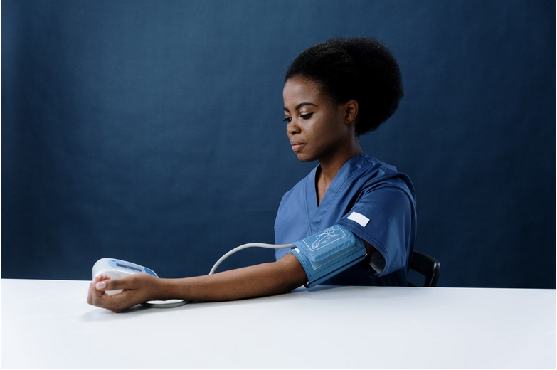 a woman checking her blood pressure