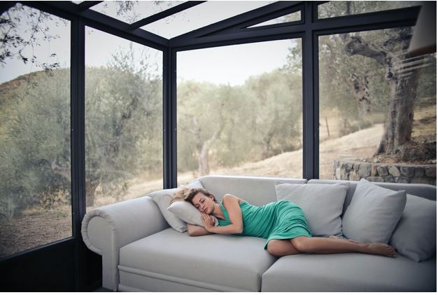 a woman napping on a couch
