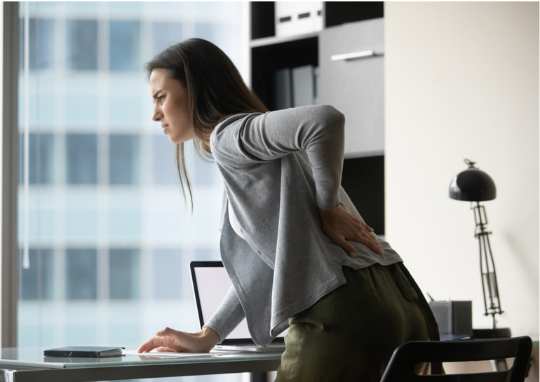 a woman suffering from back pain