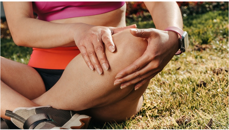 a woman suffering from leg pain