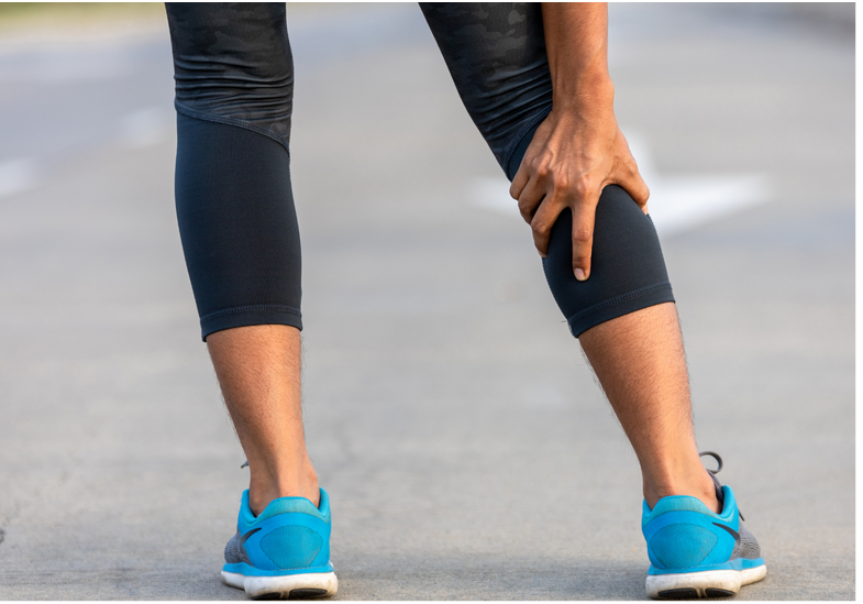 a woman suffering from sore muscles