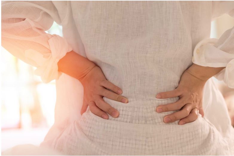 a woman suffering from spinal stenosis