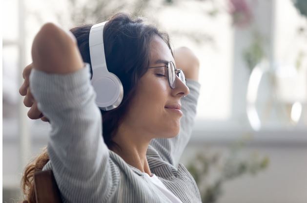 a woman using anxiety relief techniques at home