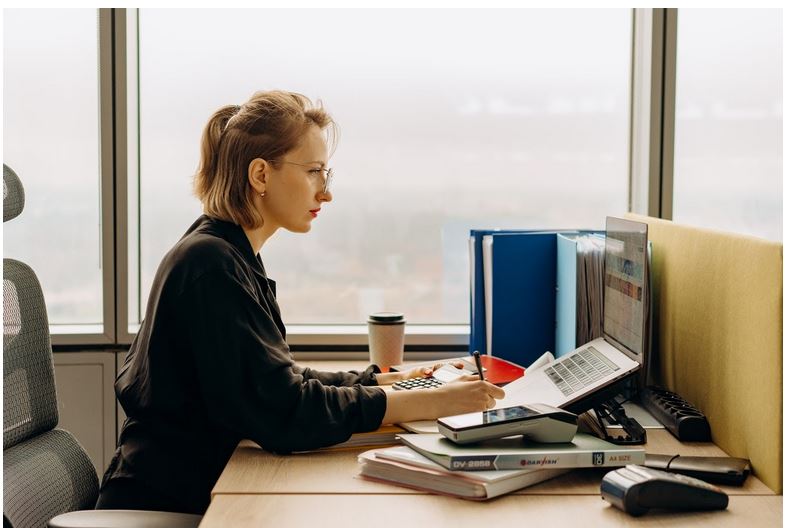 a woman working at her desk