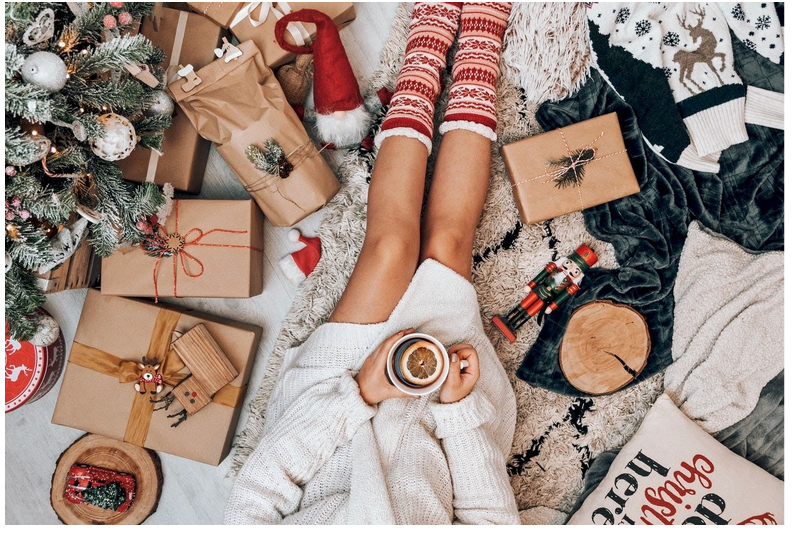 a woman wrapping holiday presents
