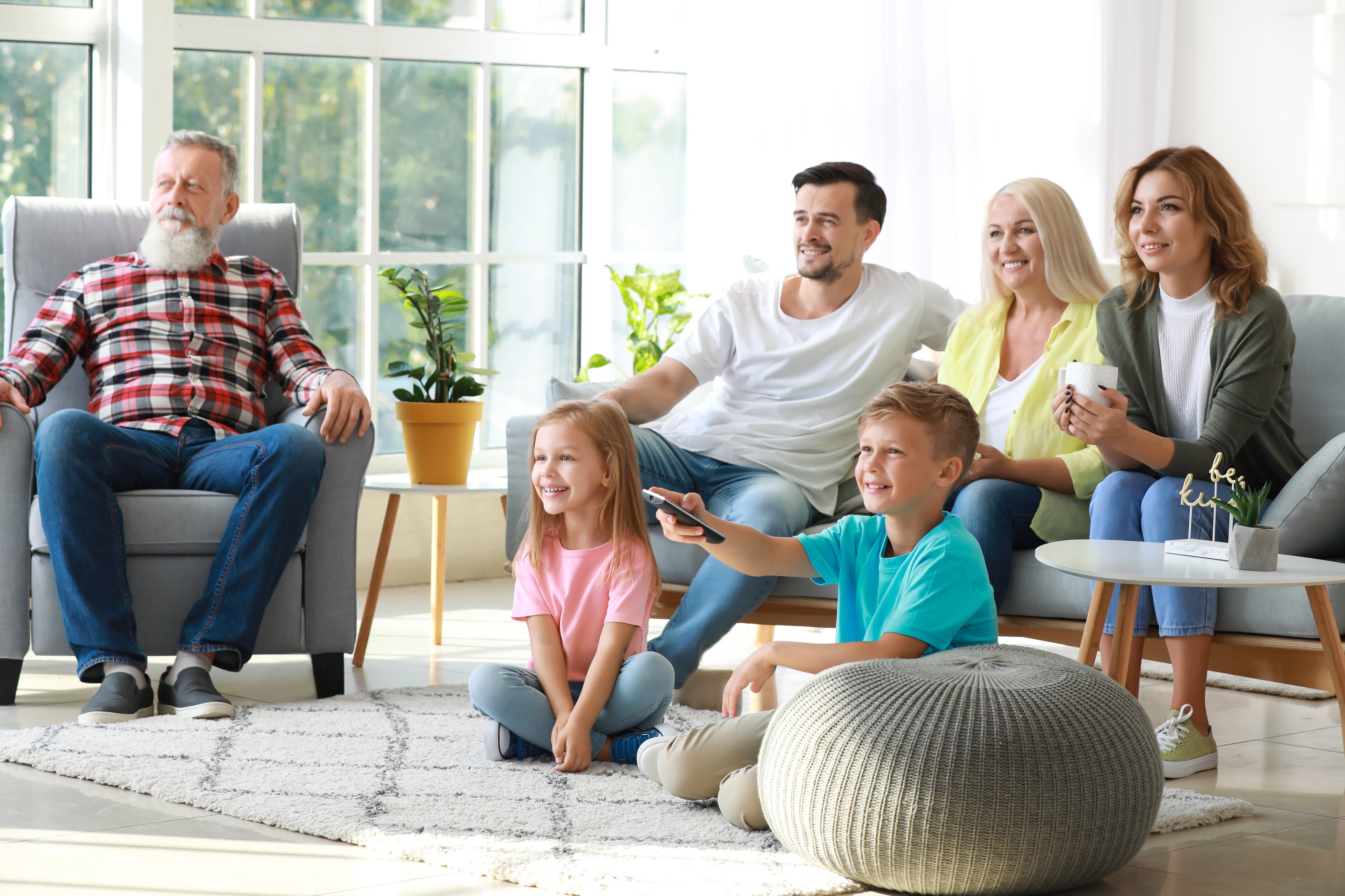 all ages family in living room with zero gravity chair