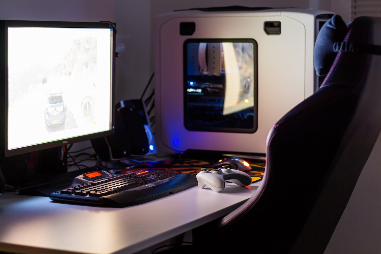 computer-setup-showing-ergonomic-chair-vs-gaming-chair