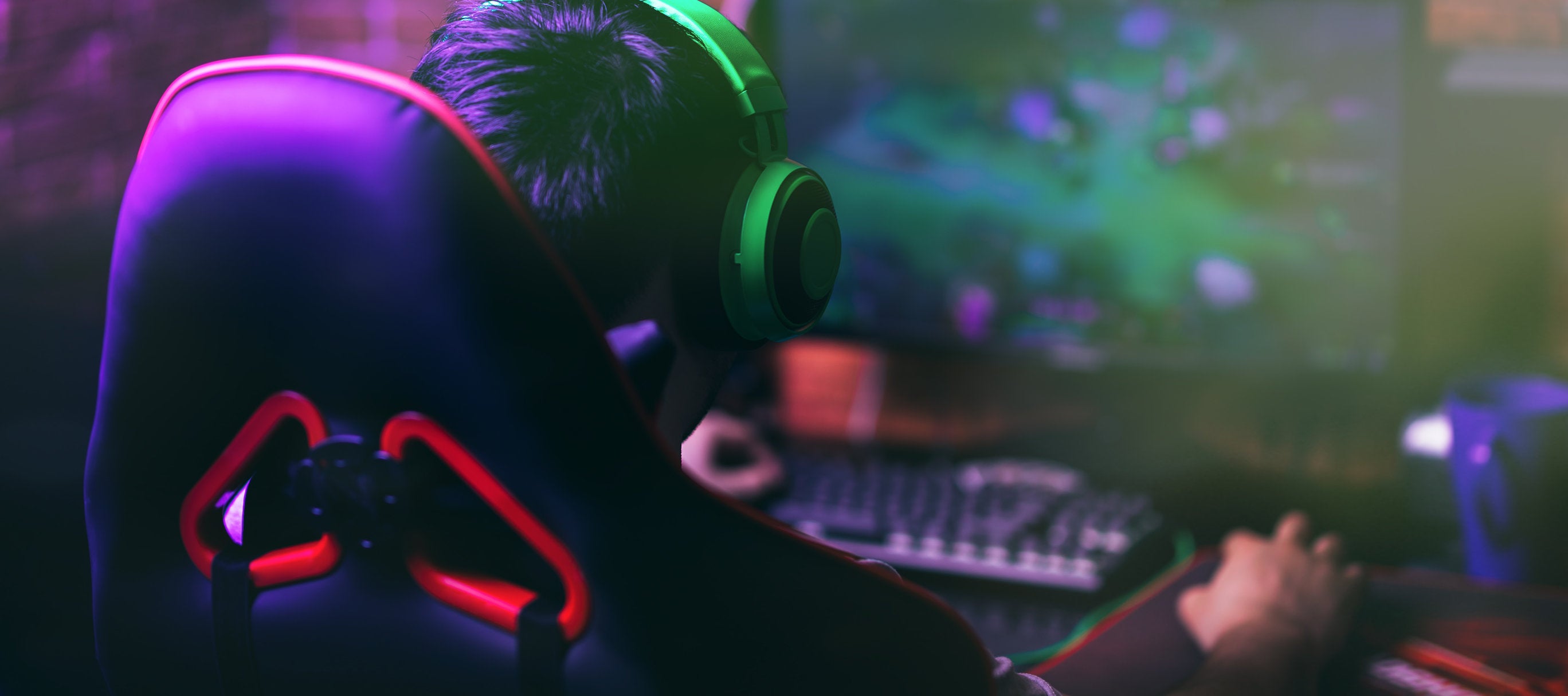guy playing video games in zero gravity chair