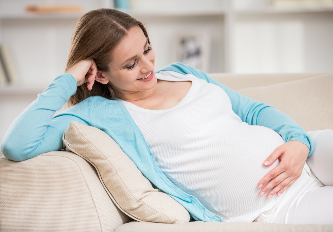 pregnant woman using a zero gravity recliner 