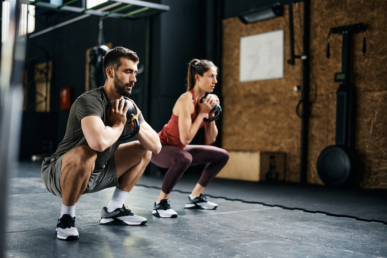 man-and-woman-with-lower-back-pain-after-squats