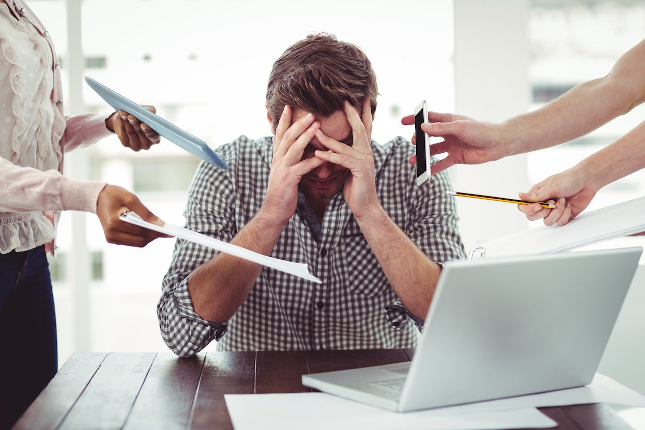man managing work stress