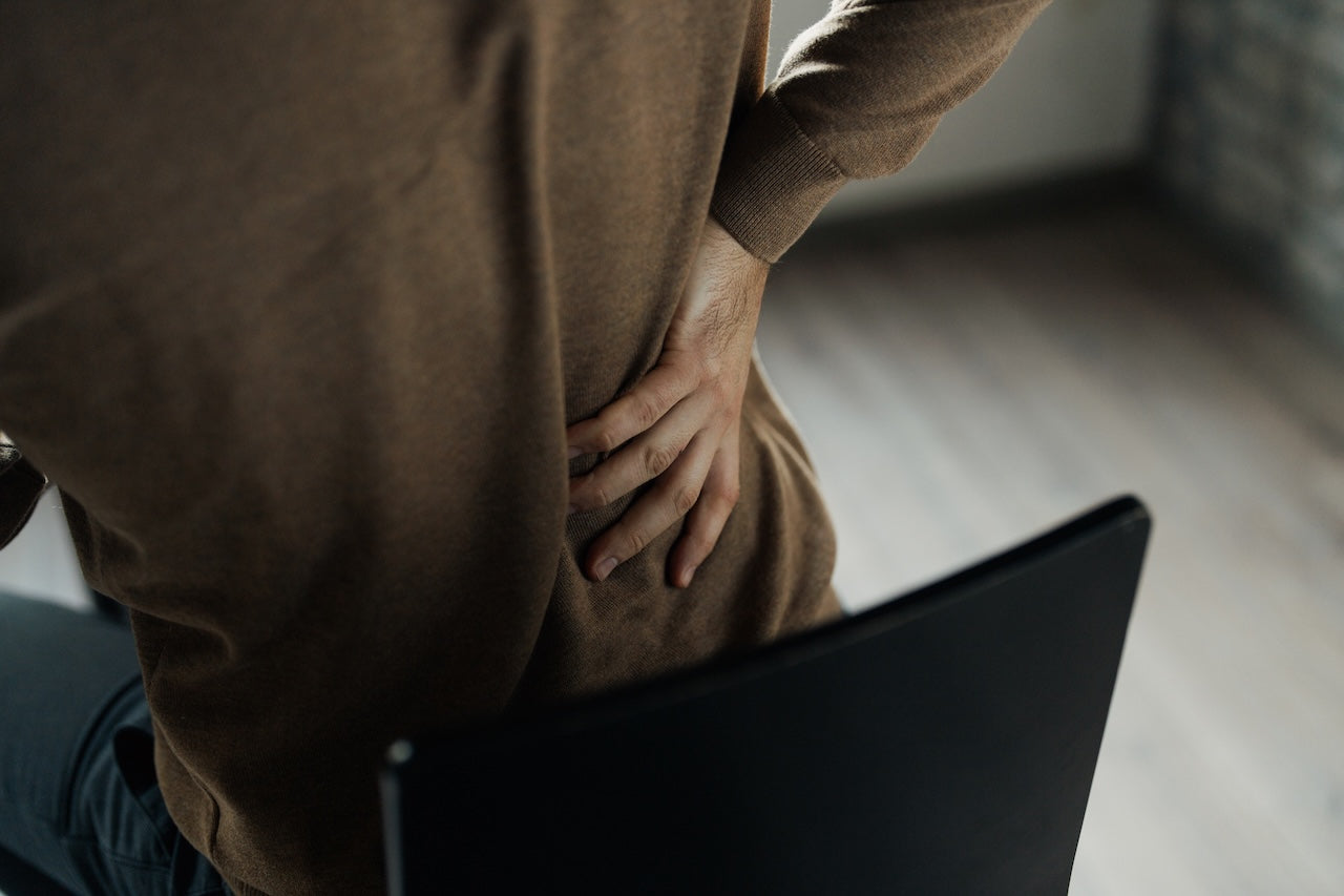 man-sitting-needing-recliner-for-back-pain-relief