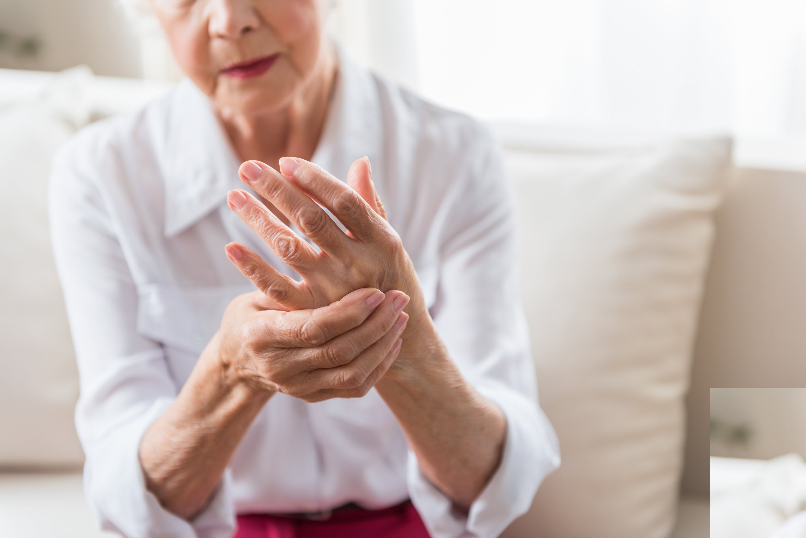 older woman suffering from arthritis and age related diseases