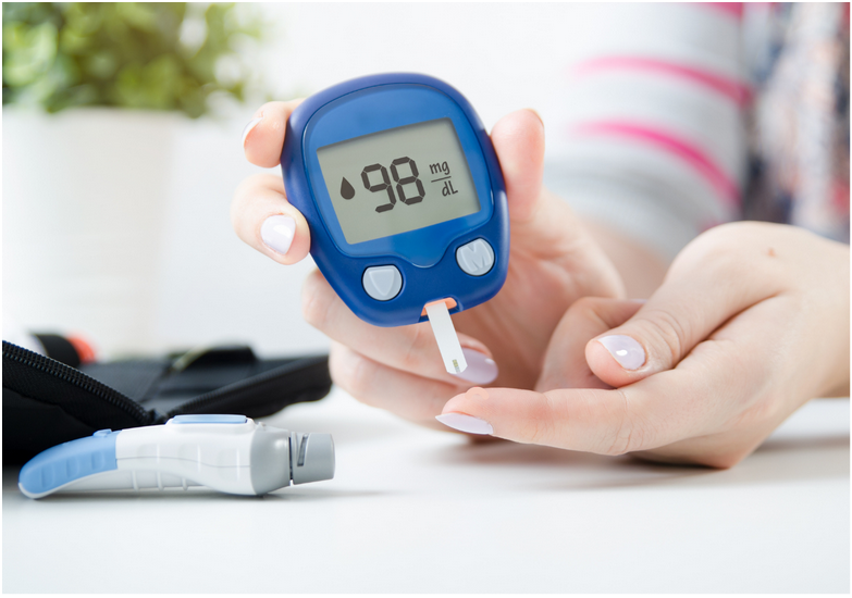 photo of someone checking their blood sugar