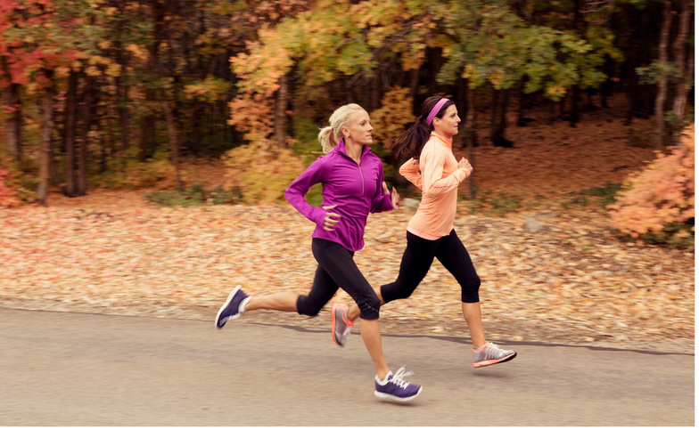 photo of two women jogging