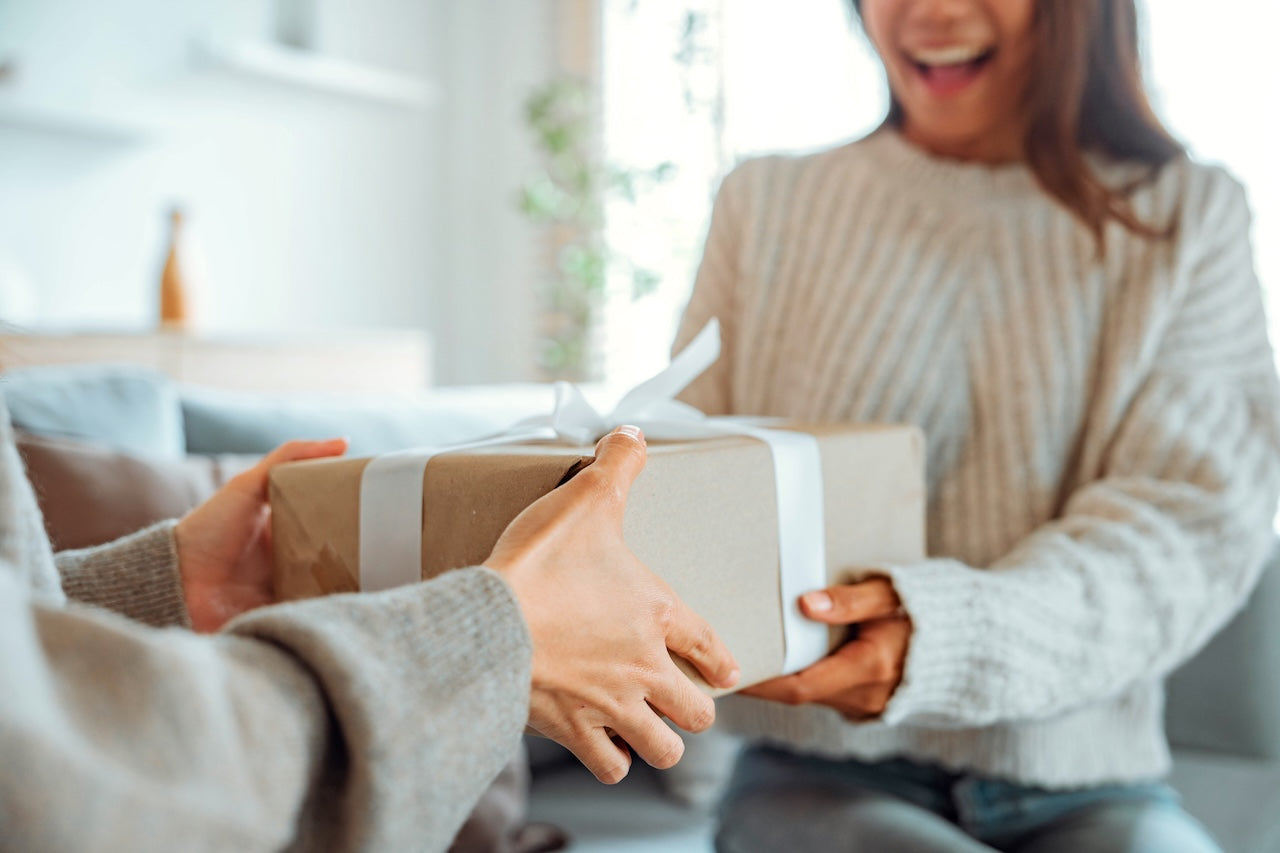 woman-receiving-best-gifts-for-homebodies