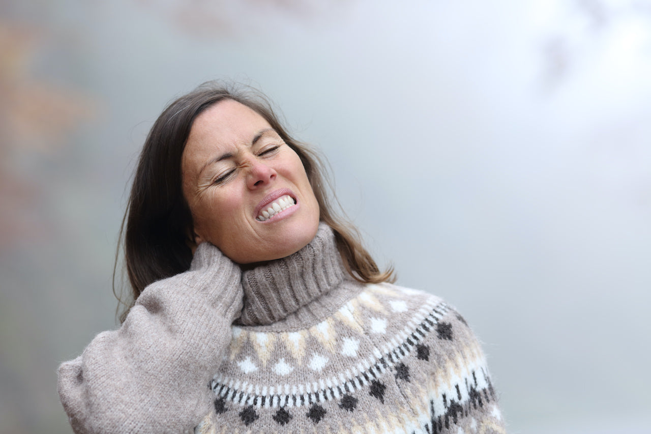 woman with body pain due to cold weather