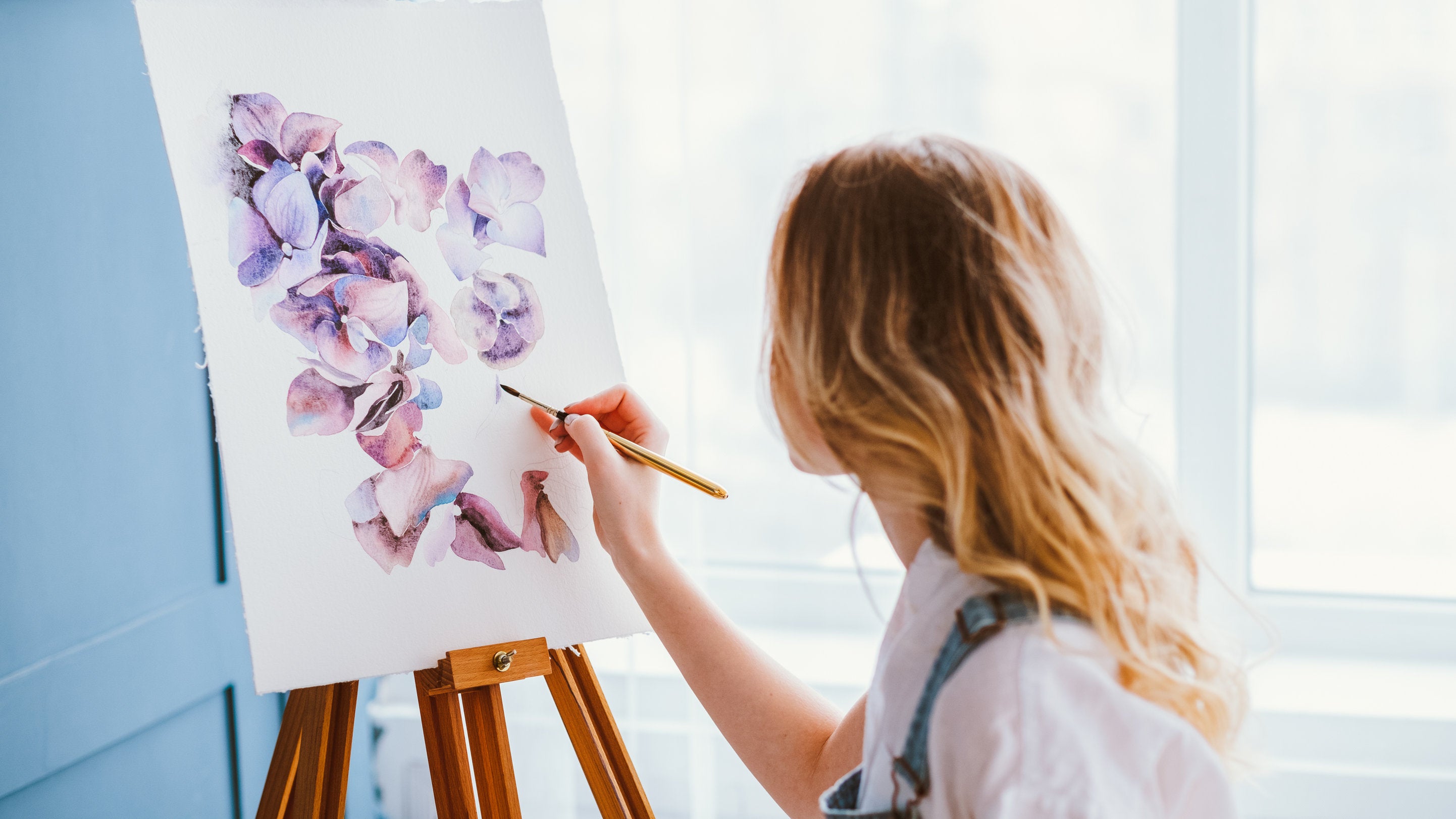 woman creating art for home self-care during quarantine