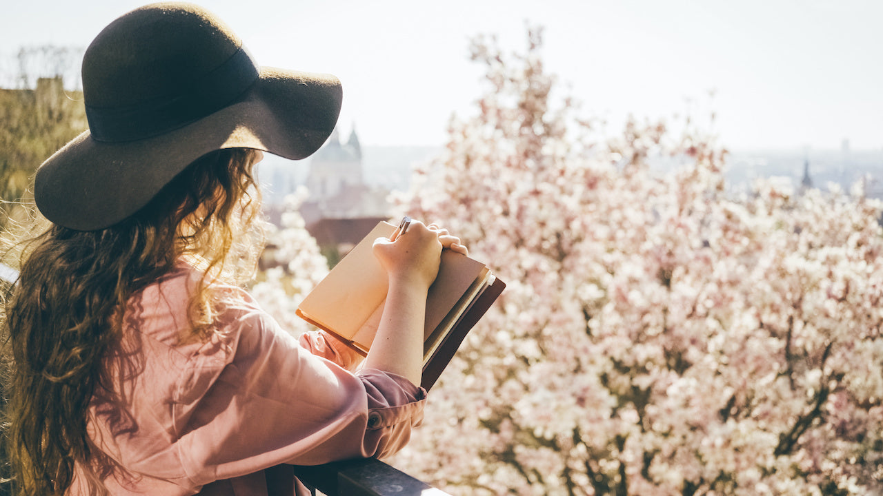 woman journaling about spring mental health tips