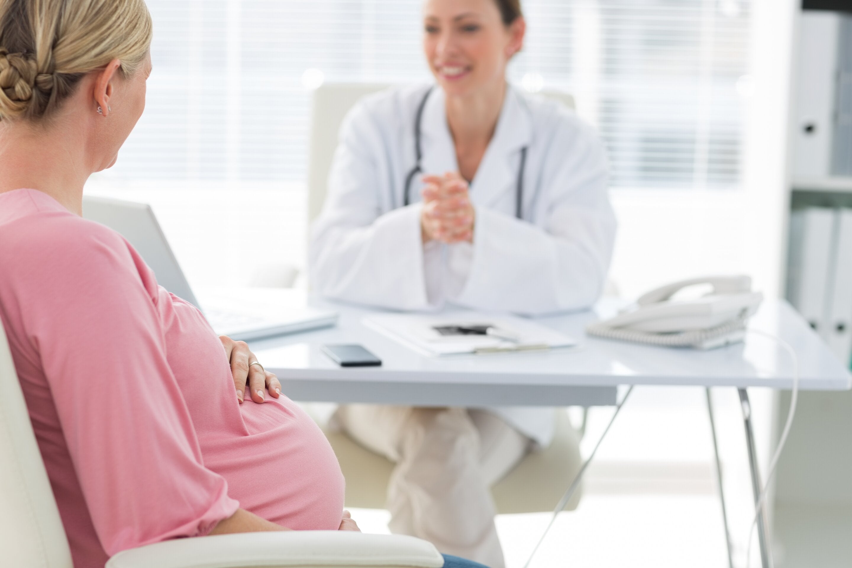 woman learning how to prevent pregnancy complications