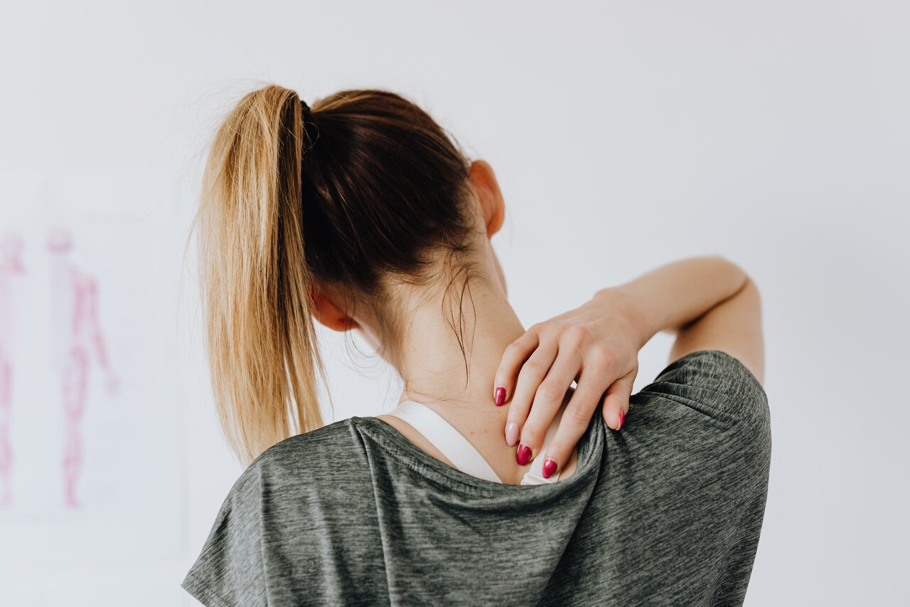 woman practicing what's good for back pain at home
