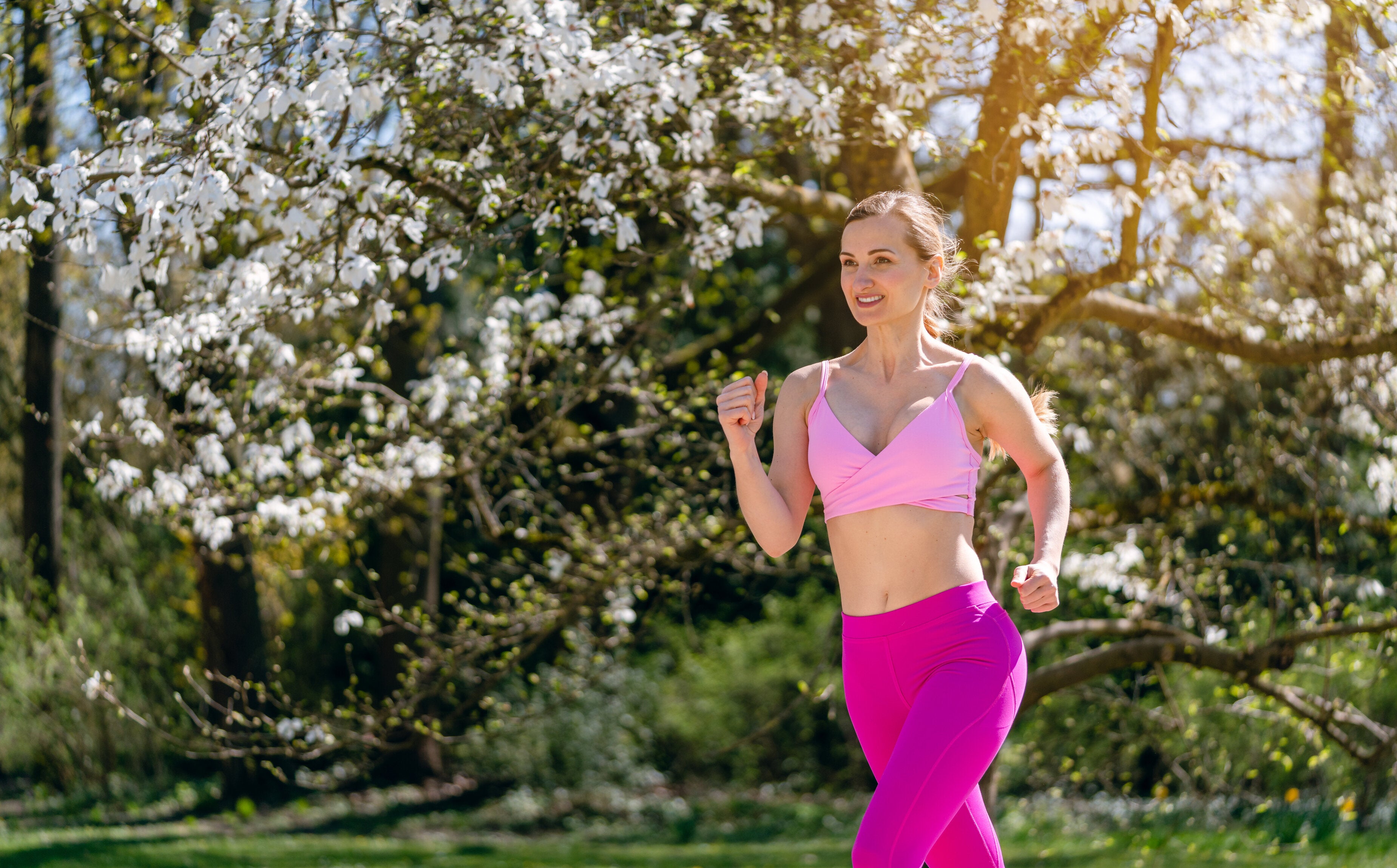 woman running for spring health and fitness goals