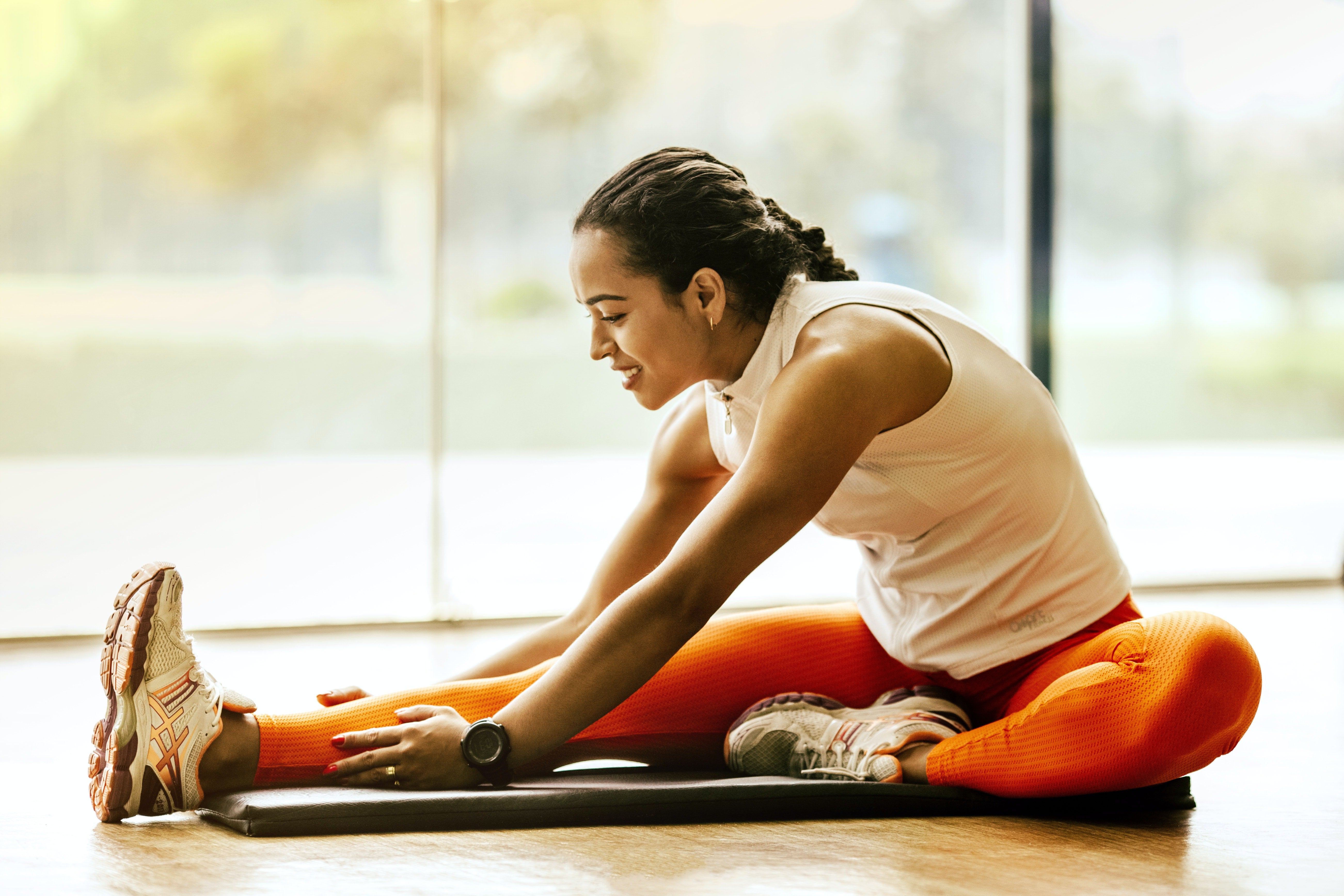 woman stretching to increase mobility and flexibility