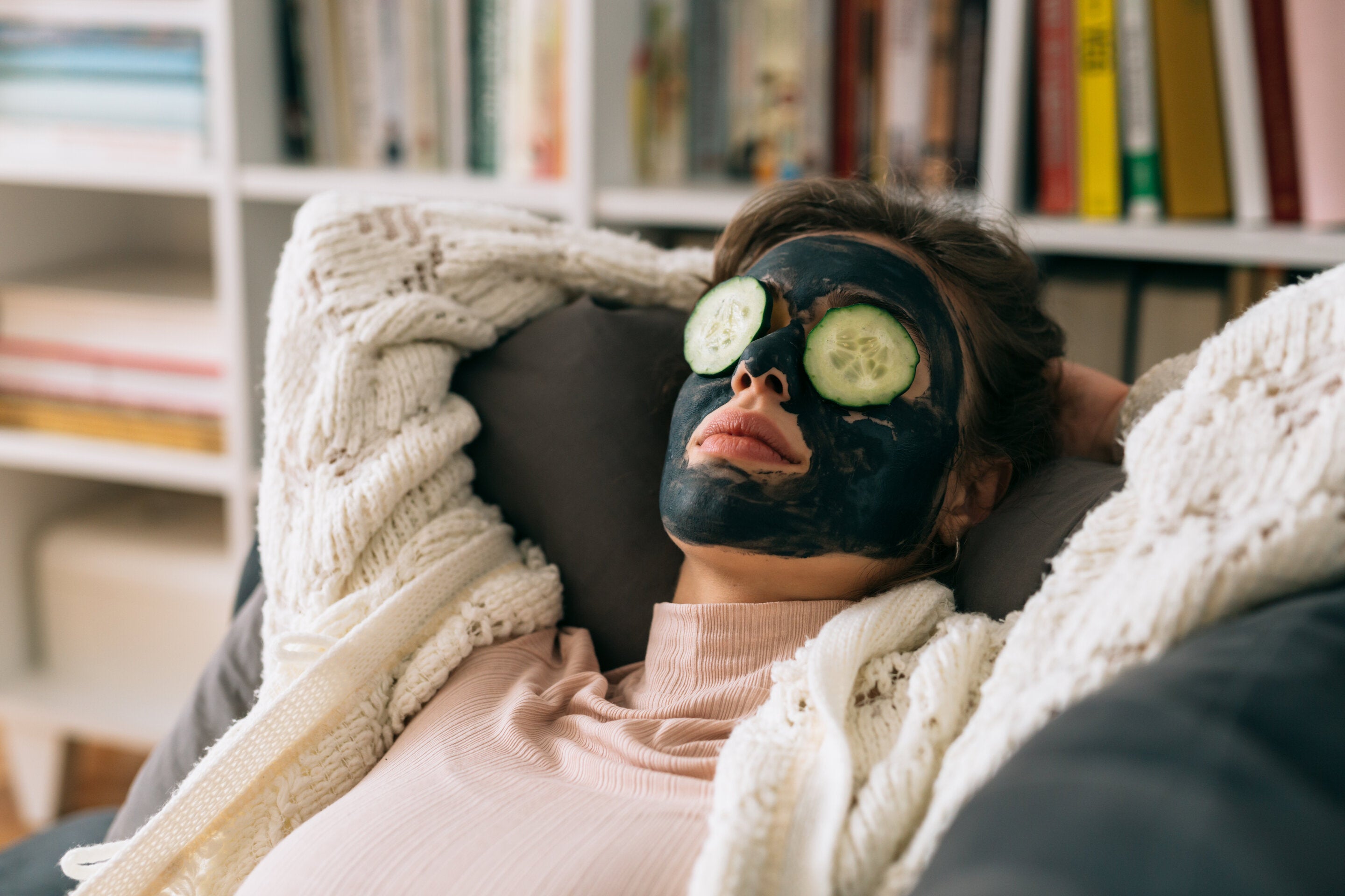 woman using zero gravity chairs with a skin improvement routine