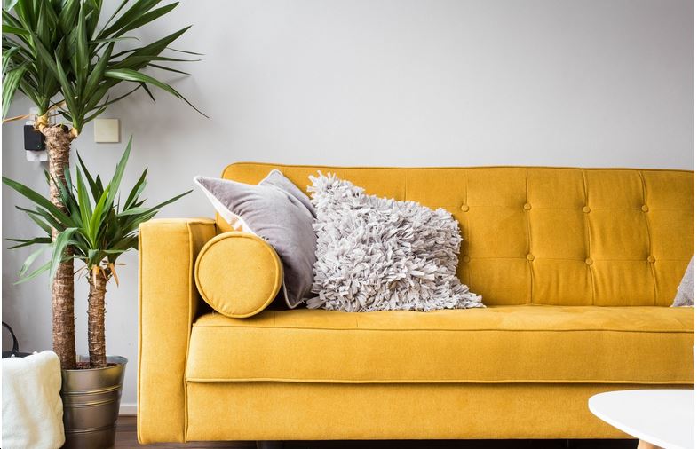 yellow sofa in family room
