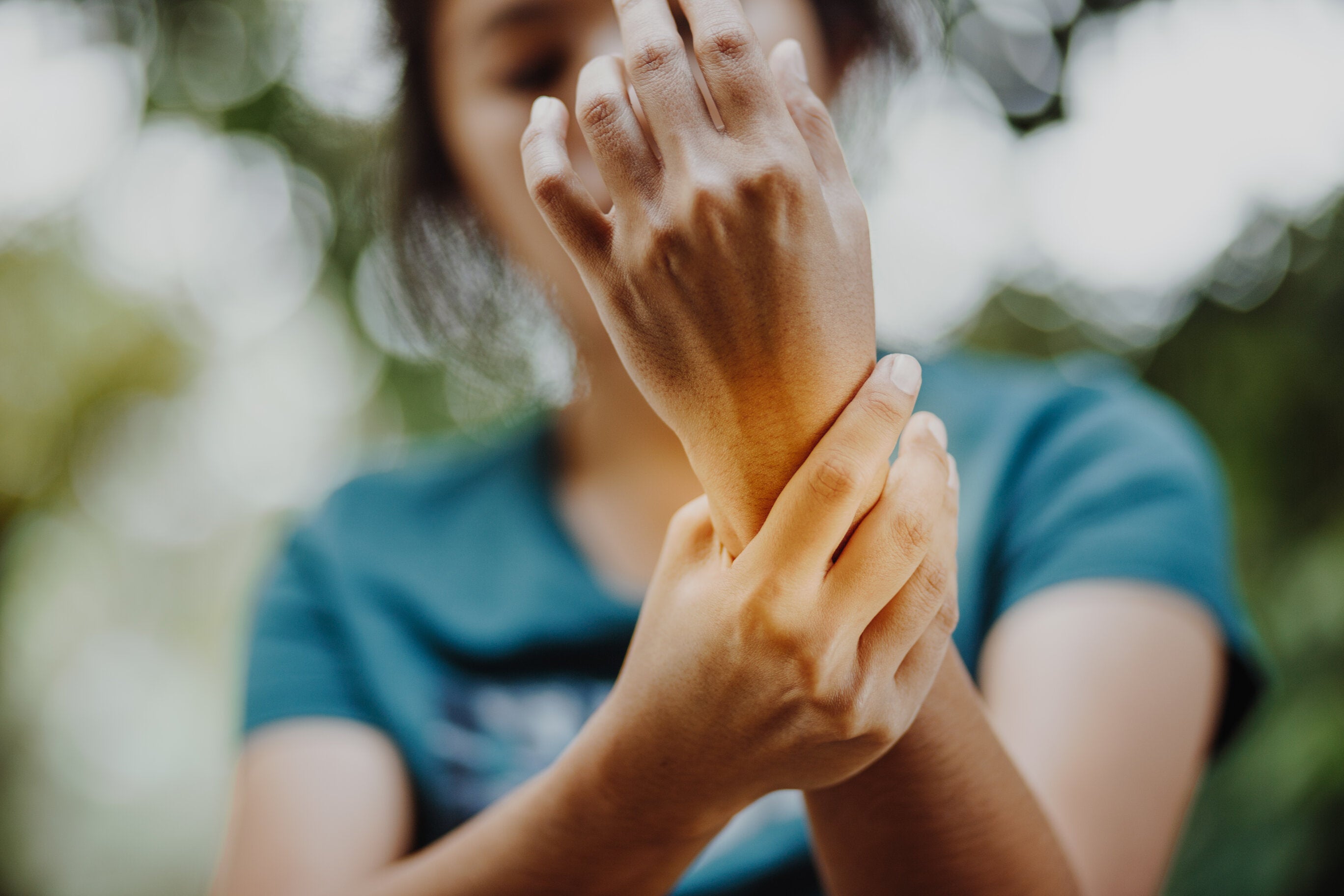young woman with arthritis pain in the wrist