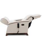 A cream-colored electric recliner chair with its footrest extended, featuring a black remote control hanging from the side and a dark wood base, shown against a solid white background.